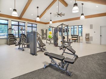 the residence apartments fitness room with exercise equipment